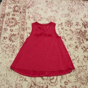 Bright pink tank top.